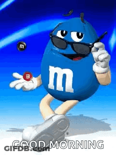 A Blue M & Ms Character Wearing Sunglasses And Holding A M & M . GIF