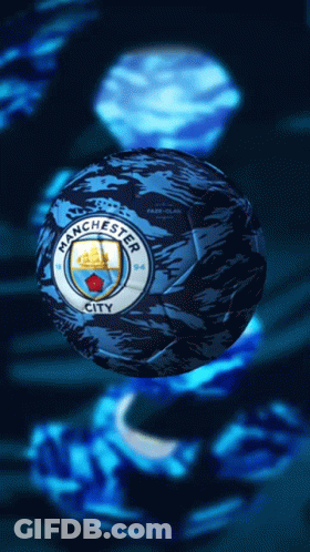 A Blue Manchester City Soccer Ball With A Ship On It GIF