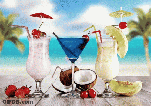 A Blue Martini With A Cherry On Top Sits Next To A White Milkshake GIF