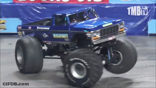 A Blue Monster Truck With The Word Firestone On It GIF