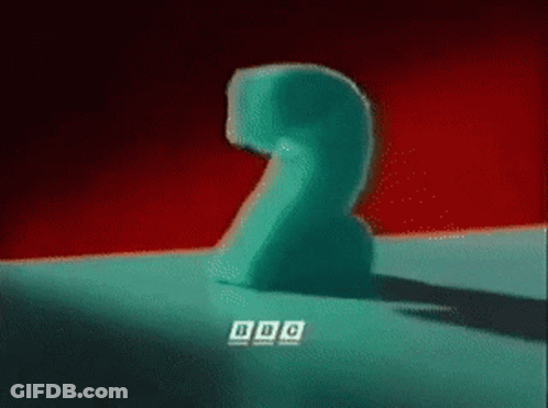 A Blue Number 2 Is Sitting On A Red Surface GIF
