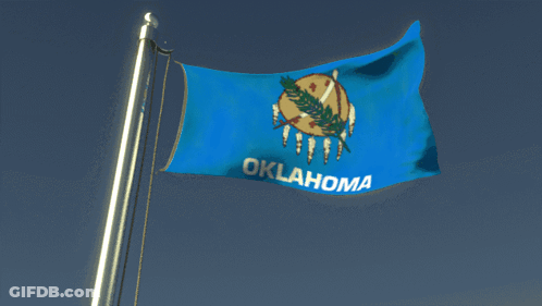 A Blue Oklahoma Flag Flies In The Wind GIF