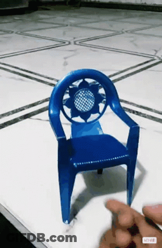 A Blue Plastic Chair With A Sunflower Design On The Back GIF