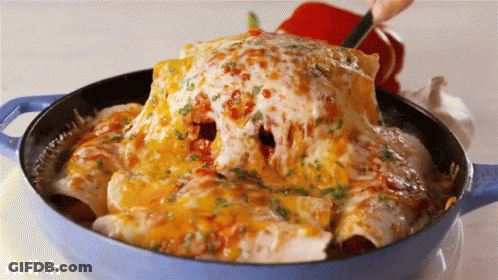 A Blue Pot Filled With Enchiladas And Cheese With The Word Delish On The Bottom GIF