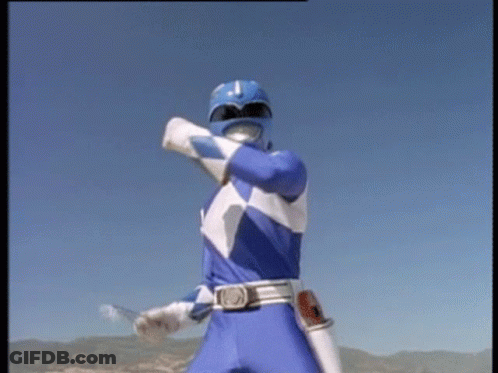 A Blue Power Ranger Is Standing In Front Of A Blue Sky Holding A Sword . GIF