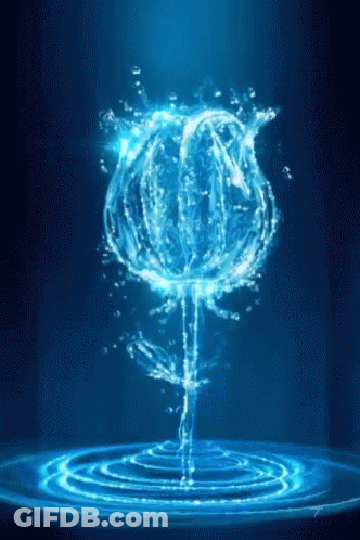 A Blue Rose Made Of Water Is Floating In The Water GIF