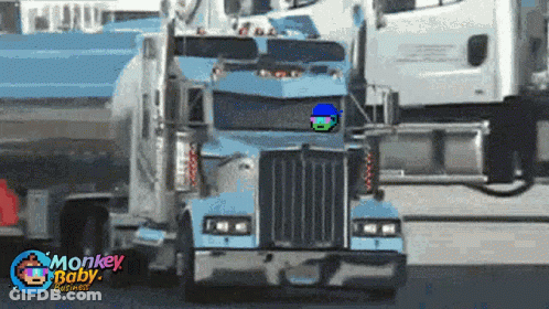 A Blue Semi Truck With Monkey Baby Graphics Written On The Bottom GIF