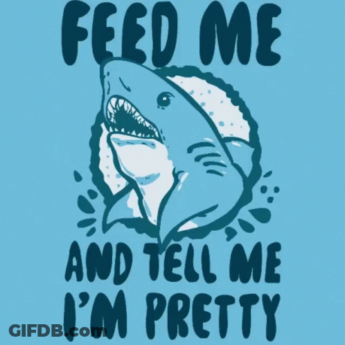 A Blue Shirt With A Shark And The Words Feed Me And Tell Me I 'M Pretty On It GIF