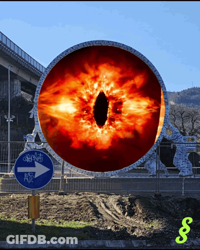 A Blue Sign With An Arrow Pointing To The Right Has A Statue In The Background GIF