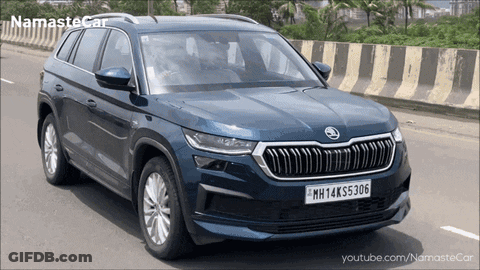 A Blue Skoda Car With A License Plate That Says Mh14k55306 GIF