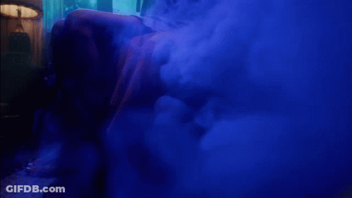 A Blue Smoke Filled Room With The Words " I Feel The Lavender Haze " On The Bottom GIF
