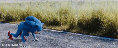 A Blue Sonic The Hedgehog Is Running Down The Road GIF