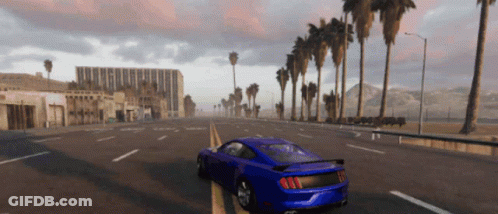 A Blue Sports Car Is Driving Down A Road With Palm Trees In The Background GIF
