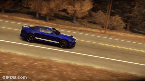 A Blue Sports Car Is Driving Down A Road With Trees In The Background GIF