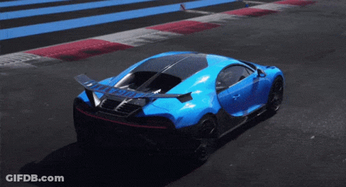 A Blue Sports Car Is Driving Down A Track With A Wing On The Back GIF