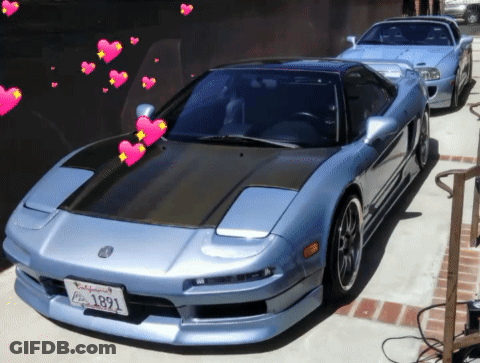 A Blue Sports Car With A California License Plate GIF