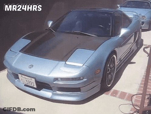 A Blue Sports Car With California License Plate 1891 Is Parked In A Driveway GIF