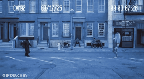 A Blue Street Scene With A Pizzeria On The Corner GIF