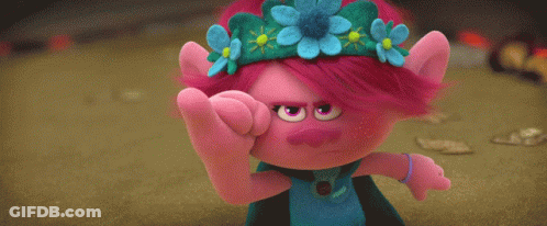 A Blue Stuffed Animal And A Pink Stuffed Animal Are Standing Next To Each Other In A Field . GIF