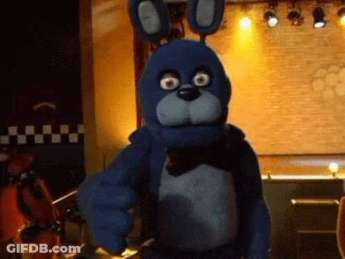 Blue Stuffed Animal Pointing At Camera GIF