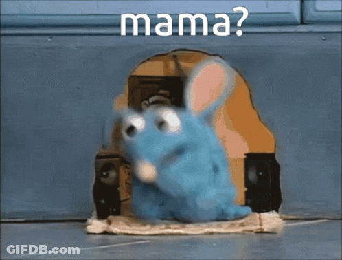 A Blue Stuffed Animal Is Sitting In A Hole With The Word Mama Written On It GIF