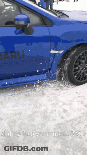 A Blue Subaru Is Driving Through The Snow GIF