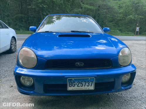 A Blue Subaru With A Virginia License Plate Bg-25737 GIF