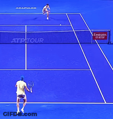 A Blue Tennis Court With A Emirates Fly Better Sign GIF