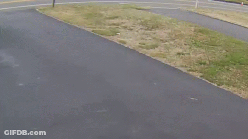 A Blue Trash Can Sits On The Side Of The Road Next To A Sign That Says The Weekend GIF