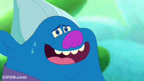 A Blue Troll With A Purple Nose And A White Hat Is Smiling GIF