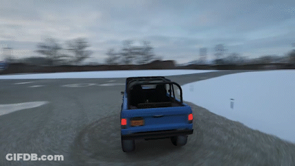 A Blue Truck Is Driving Down A Snowy Road With A New York License Plate GIF