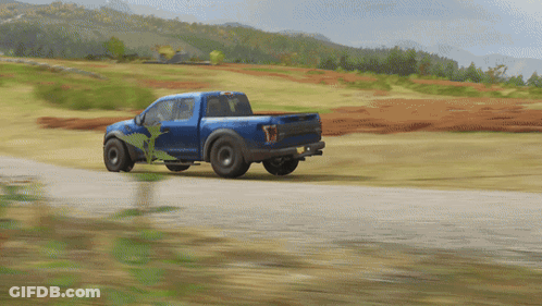 A Blue Truck With The Word Raptor On The Back GIF