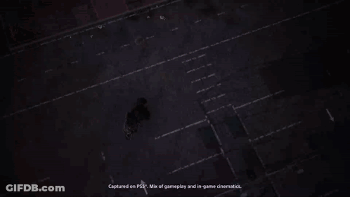 A Blue Van Is Parked In Front Of A Wall That Has The Word Entrance Painted On It GIF