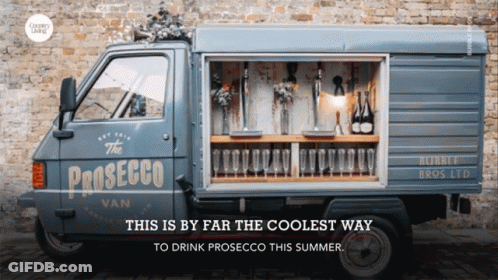 A Blue Van That Says The Prosecco Van On It GIF