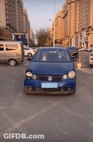A Blue Volkswagen Car With A License Plate That Says Lkru035 GIF