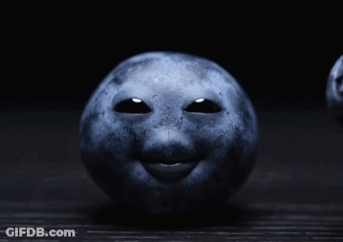 A Blueberry With A Face On It GIF