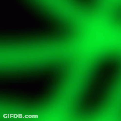 A Blurred Green Background With A Swirl In The Middle GIF