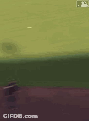 A Blurred Image Of A Baseball Field With The MLB Logo GIF