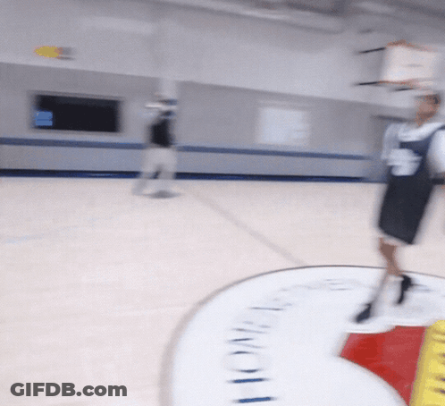 A Blurred Image Of A Basketball Court With A Sign That Says Lone Star GIF