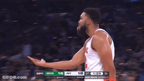 A Blurred Image Of A Basketball Game Between Bos And East Semis GIF