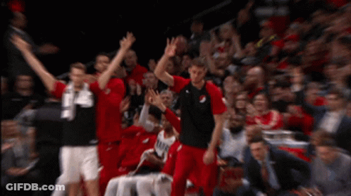 A Blurred Image Of A Basketball Game With Players Wearing Red And Black Jerseys With The Number 24 On Them GIF