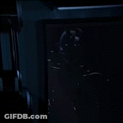 A Blurred Image Of A Blue Wall With A Clock On It GIF