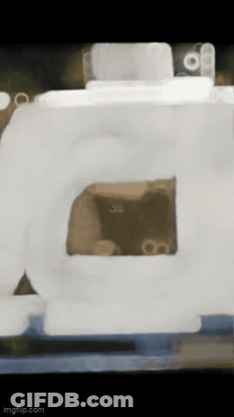 A Blurred Image Of A Box With A Hole In The Middle GIF