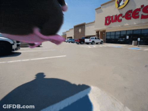 A Blurred Image Of A Buck Ee 'S Store GIF