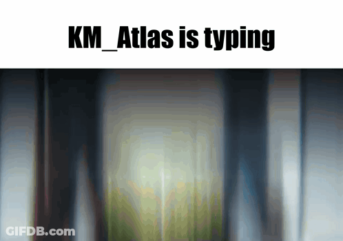Blurred Building Image With K.M. Atlas Typing GIF