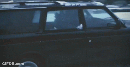A Blurred Image Of A Car Driving Down A Street GIF