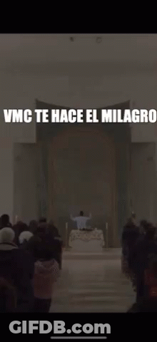 A Blurred Image Of A Church With The Words Vmc Te Hace El Milagros GIF