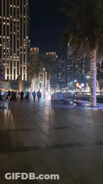A Blurred Image Of A City Street At Night With A Sign That Says ' A ' On It GIF