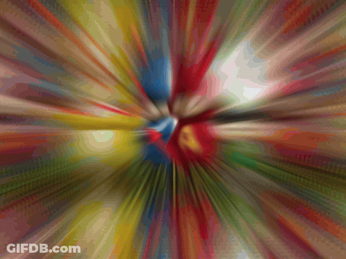 A Blurred Image Of A Colorful Explosion Of Colors GIF