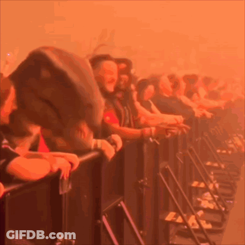 A Blurred Image Of A Crowd Of People Watching A Concert GIF